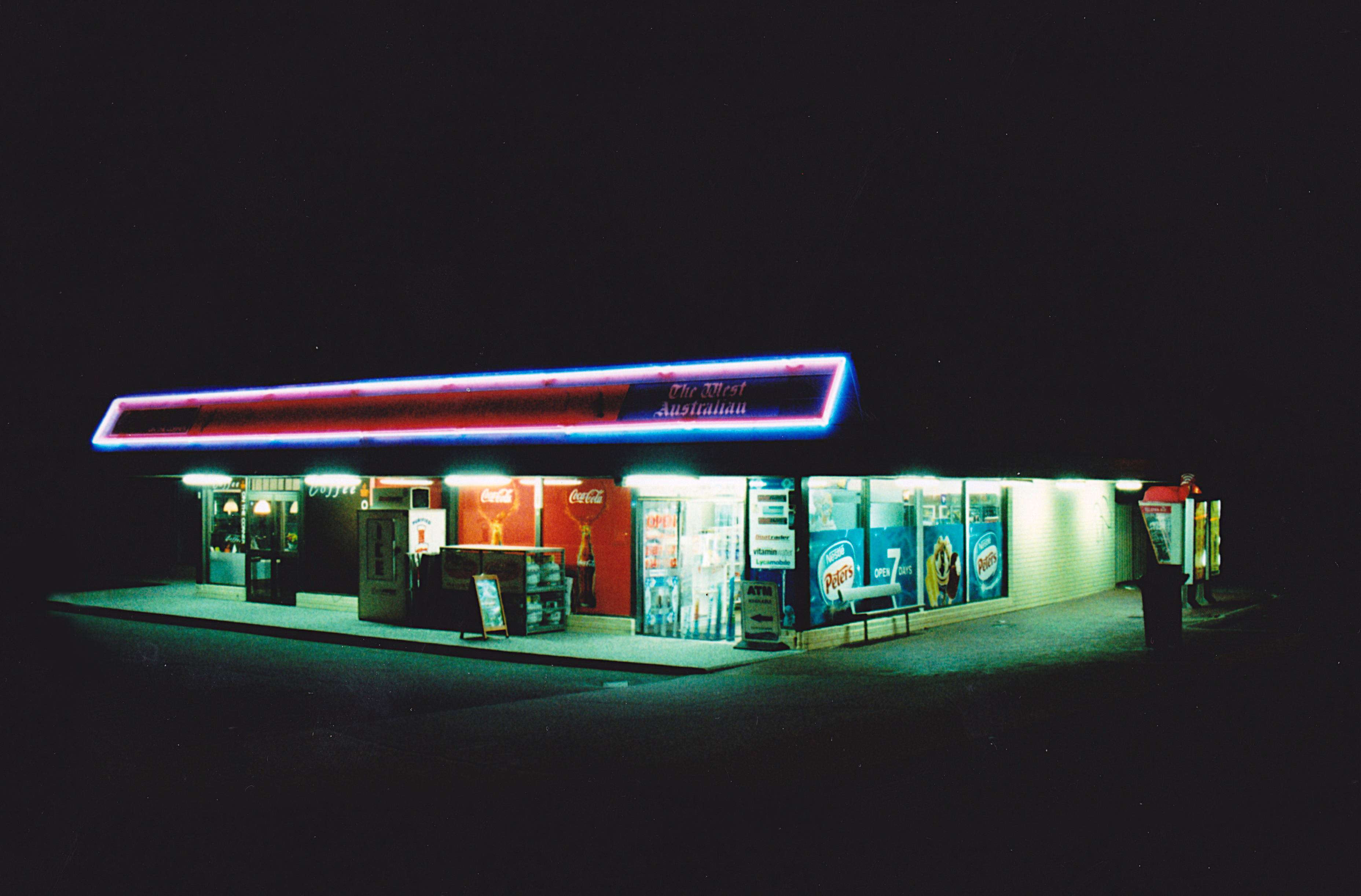 The meme is an image of a 7-Eleven store at night, with the neon sign reading "7-Eleven" and the store's entrance is dark. The text "7-Eleven" is written in a bold, neon font. The image is captioned "7-Eleven at 3 am, I'm not a morning person".